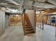 Unfinished basement with exposed framing and stairs at 108 Legend Creek Dr, Canton, GA 30114