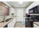 Well-equipped kitchen featuring granite countertops and black appliances at 4104 Fairington Village Dr, Lithonia, GA 30038