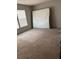 Simple carpeted bedroom with large window at 5424 Magnolia Way # 412, Buford, GA 30518