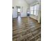 Bright bedroom with wood-look floors and access to bathroom at 2770 Blake Towers Ln, Buford, GA 30519