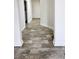 Long hallway with wood-look tile floors at 2770 Blake Towers Ln, Buford, GA 30519