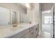 Double vanity bathroom with neutral tones and tile flooring at 11250 Crestview Ter, Johns Creek, GA 30024