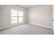 Bright bedroom featuring neutral wall tones and plush carpeting at 11250 Crestview Ter, Johns Creek, GA 30024