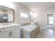 Main bathroom features double vanity, soaking tub, and separate shower at 11250 Crestview Ter, Johns Creek, GA 30024