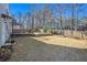 Large backyard with a wooden fence and mature trees at 4765 Limestone Nw Ln, Acworth, GA 30102