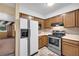 View of kitchen with stainless steel appliances and wood cabinets at 3734 N Camp Creek Sw Pkwy, Atlanta, GA 30331