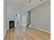 Living room with fireplace, ceiling fan and light gray walls at 6514 Grey Fox Way, Riverdale, GA 30296