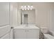 Bright bathroom with white vanity, mirror and toilet at 1186 Westhampton Way # 134, Villa Rica, GA 30180