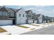 Row of townhomes showcasing neutral color palettes and attached garages at 1186 Westhampton Way # 134, Villa Rica, GA 30180