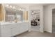 Modern bathroom with double sinks and a view into the bedroom at 1193 Westhampton Way # 145, Villa Rica, GA 30180