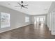 Open concept living room with hardwood floors and kitchen view at 1543 Broad Ne St, Conyers, GA 30012