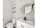 Modern powder room with floating vanity, gold mirror, and floating shelves at 2451 Napa Valley Dr, Villa Rica, GA 30180