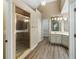 Bathroom with shower, double vanity, and updated flooring at 129 Talon Pl, Mcdonough, GA 30253