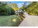 House exterior showing a two-story home with a long driveway and a large yard at 129 Talon Pl, Mcdonough, GA 30253