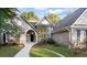 Brick house exterior showcasing a two-story home with a large front yard at 129 Talon Pl, Mcdonough, GA 30253