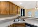 Kitchen with double sink, light brown cabinets, and granite countertops at 129 Talon Pl, Mcdonough, GA 30253