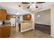 Kitchen with light brown cabinets, a breakfast bar, and tile flooring at 129 Talon Pl, Mcdonough, GA 30253