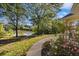 Pathway to lake with lush landscaping at 129 Talon Pl, Mcdonough, GA 30253