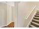 Staircase leading to upper level with hardwood floors at 129 Talon Pl, Mcdonough, GA 30253