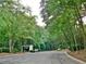 Community entrance with lush trees and landscaping at 1403 Augusta Se Dr, Marietta, GA 30067