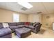 Spacious basement recreation area with sectional sofa at 4388 Sleepy Hollow Cv, Lilburn, GA 30047