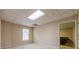 Spacious basement room with window and view into another room at 4388 Sleepy Hollow Cv, Lilburn, GA 30047