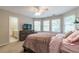 Bedroom with a queen bed and bay window at 4388 Sleepy Hollow Cv, Lilburn, GA 30047