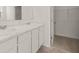 Bathroom with double vanity, marble countertop and walk-in closet at 532 Vervain Drive, Locust Grove, GA 30248