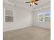 Spacious bedroom with carpet flooring and ceiling fan at 532 Vervain Drive, Locust Grove, GA 30248