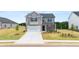 Two-story home with brick and siding, attached garage, and landscaping at 532 Vervain Drive, Locust Grove, GA 30248