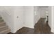 Bright hallway with stairs and hardwood floors at 532 Vervain Drive, Locust Grove, GA 30248
