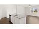 Spacious kitchen island with granite countertop and stainless steel dishwasher at 532 Vervain Drive, Locust Grove, GA 30248