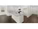 Modern kitchen with island, granite countertops, and stainless steel appliances at 532 Vervain Drive, Locust Grove, GA 30248