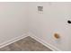 Laundry room with tile floor and hookups for washer and dryer at 532 Vervain Drive, Locust Grove, GA 30248