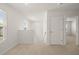 Bright loft area with carpet, two doors, and view to stairs at 532 Vervain Drive, Locust Grove, GA 30248