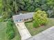 Ranch home with gray and brick exterior, nestled in woods at 3569 Briar Dr, Lithia Springs, GA 30122