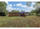 Large backyard with a deck, stairs, and plenty of green space at 3569 Briar Dr, Lithia Springs, GA 30122