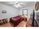 Cozy bedroom with hardwood floors and a ceiling fan at 3569 Briar Dr, Lithia Springs, GA 30122