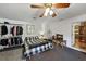 Large bedroom with black and white bedding, walk-in closet, and TV at 3569 Briar Dr, Lithia Springs, GA 30122