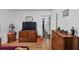 Well-lit bedroom with wood floors and two dressers at 3569 Briar Dr, Lithia Springs, GA 30122