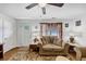 Living room with light walls, a couch, and a ceiling fan at 3569 Briar Dr, Lithia Springs, GA 30122