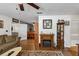 Living room with hardwood floors, fireplace, and view to dining area at 3569 Briar Dr, Lithia Springs, GA 30122