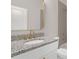 Bathroom with single vanity and gold fixtures at 1794 Spring Ne St, Conyers, GA 30012