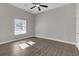 Spacious bedroom with hardwood floors, neutral walls and large window at 1794 Spring Ne St, Conyers, GA 30012