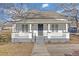 Charming renovated cottage with a front porch and new landscaping at 1794 Spring Ne St, Conyers, GA 30012