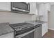 Modern kitchen with stainless steel appliances and granite countertops at 1794 Spring Ne St, Conyers, GA 30012