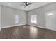 Bright and airy living room with dark hardwood floors and neutral walls at 1794 Spring Ne St, Conyers, GA 30012