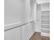 Spacious walk-in closet with shelves and hanging rods at 1794 Spring Ne St, Conyers, GA 30012