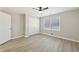 Well-lit bedroom with neutral walls, double doors, and vinyl flooring at 168 Callaway Rd, Fayetteville, GA 30215