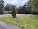 Brick ranch house with a large yard at 5297 Rock Springs Rd, Lithonia, GA 30038